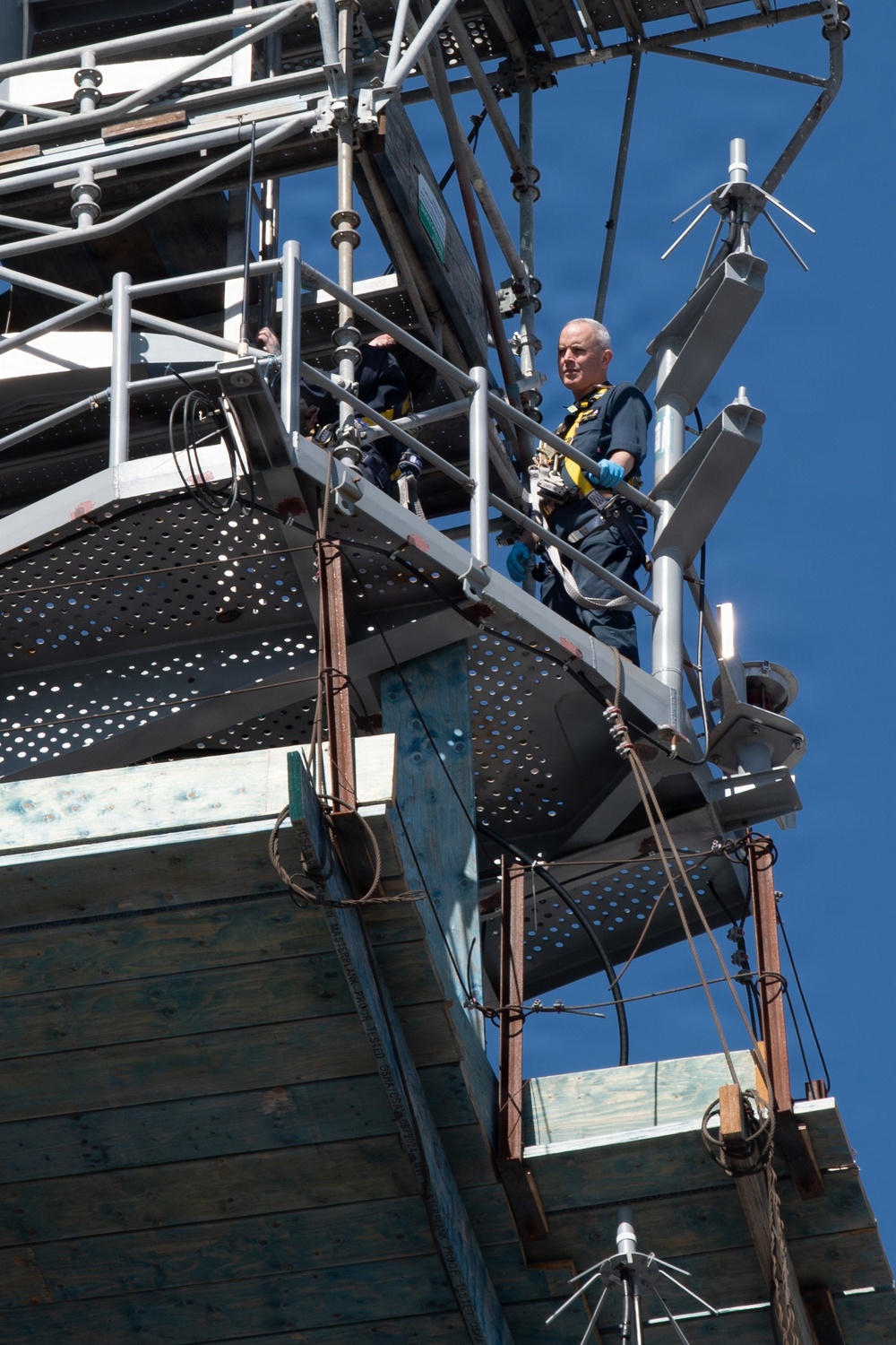 Commanding Officer Capt. Matthew Kiser goes aloft