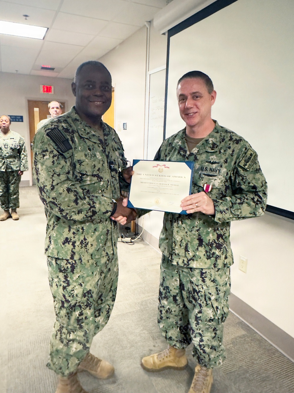 Cmdr. Revitzer receives award as he ends his tour