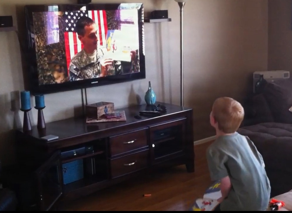 CW3 Durbin reads to his son while deployed to Afghanistan