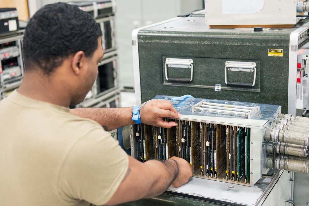 Airmen work on the life-saving automatic ground collision avoidance system