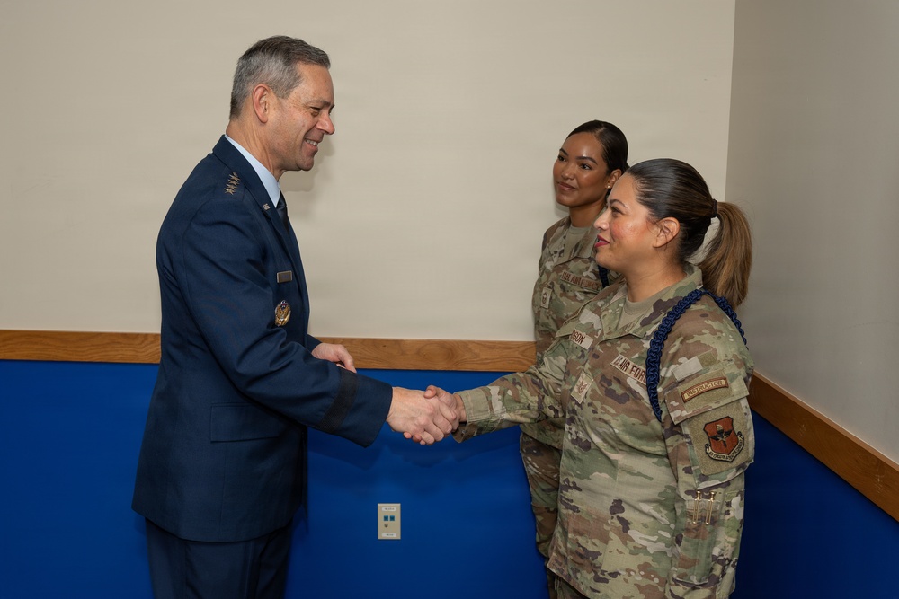 Air Force Chief of Staff Gen. Ken Wilsbach celebrates the newest Airmen