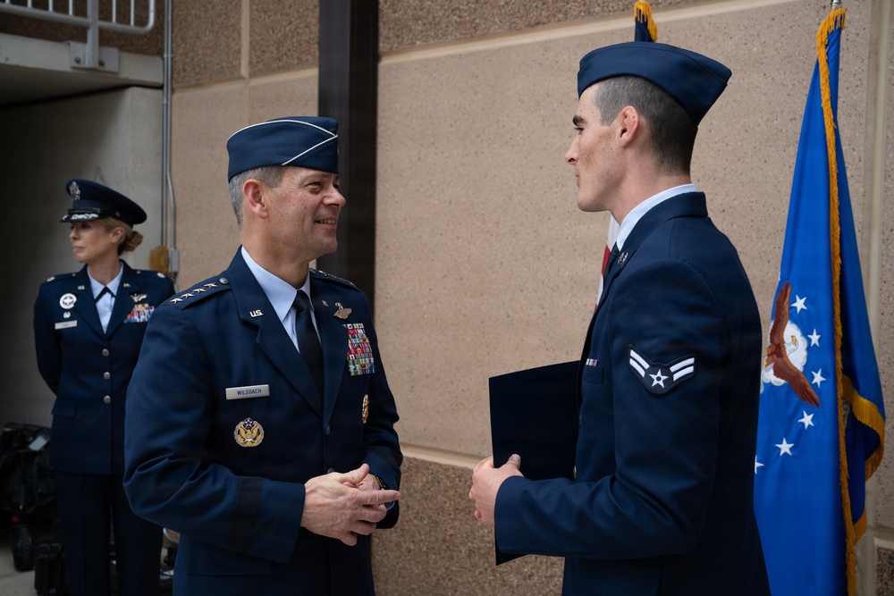 Air Force Chief of Staff Gen. Ken Wilsbach celebrates the newest Airmen