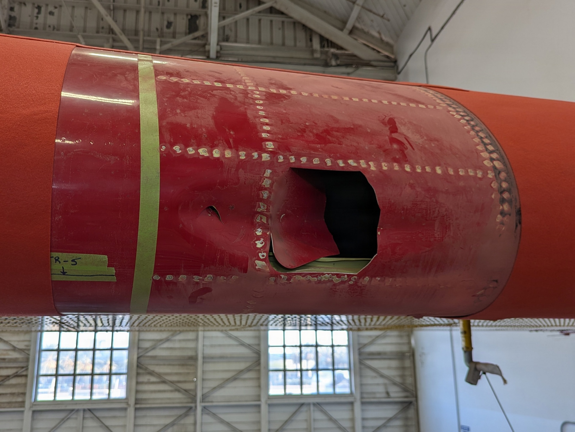 FBI photograph of the firefighting aircraft's damaged left wing inside a hangar after the January 2025 Palisades drone collision