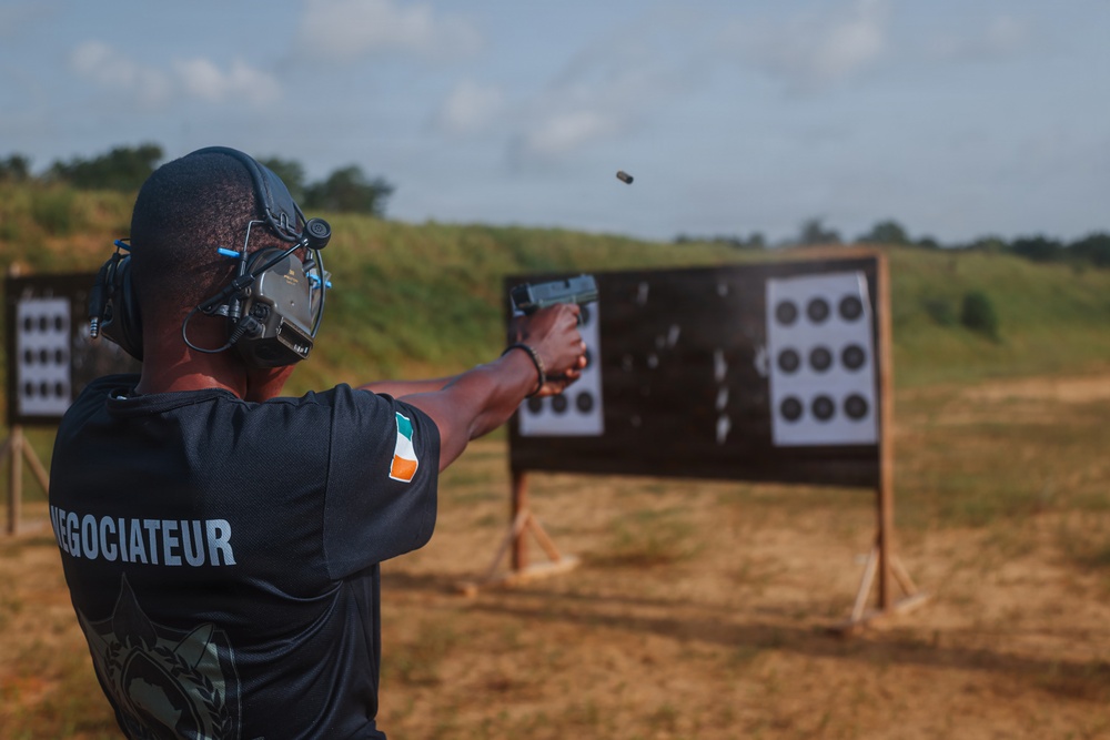 Ivorian law enforcement executes pistol marksmanship drills during Flintlock 26