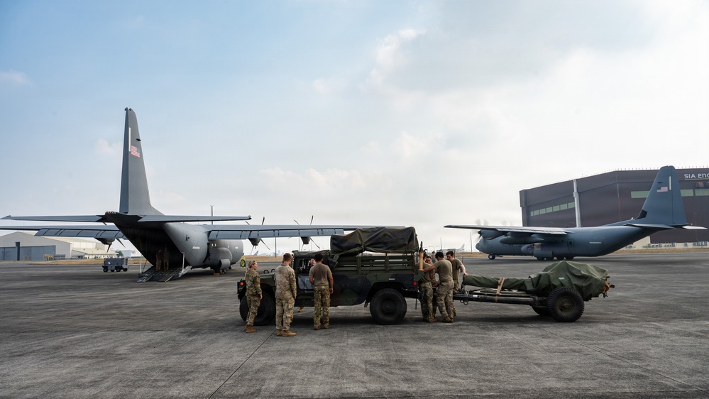 Balikatan 2026: 317th AW, 25th ID load Humvee, howitzer onto C-130J