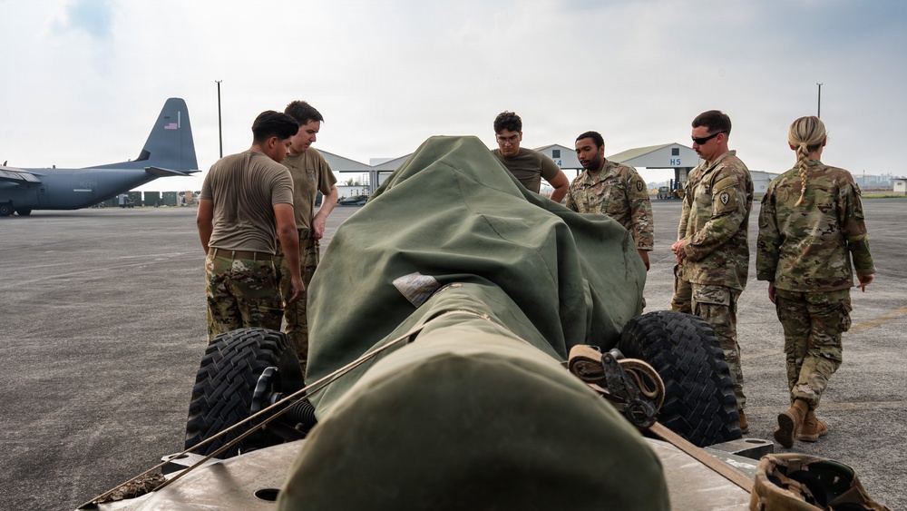 Balikatan 2026: 317th AW, 25th ID load Humvee, howitzer onto C-130J