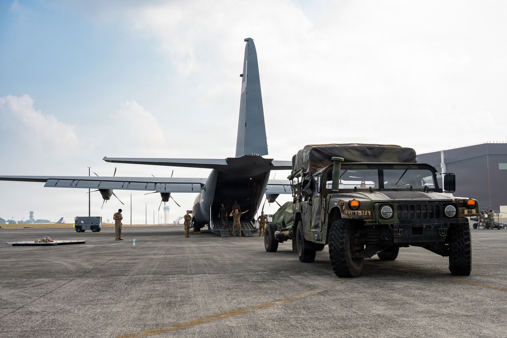Balikatan 2026: 317th AW, 25th ID load Humvee, howitzer onto C-130J