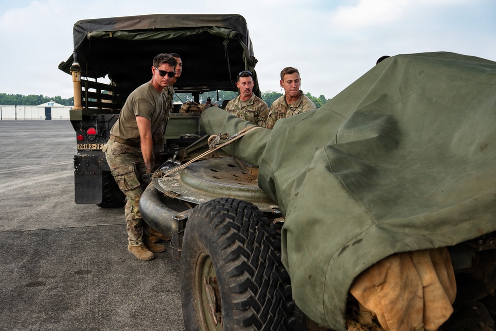 Balikatan 2026: 317th AW, 25th ID load Humvee, howitzer onto C-130J