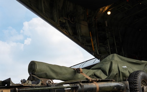 Balikatan 2026: 317th AW, 25th ID load Humvee, howitzer onto C-130J