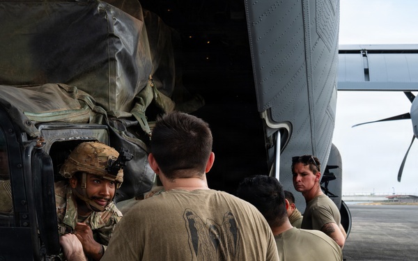 Balikatan 2026: 317th AW, 25th ID load Humvee, howitzer onto C-130J