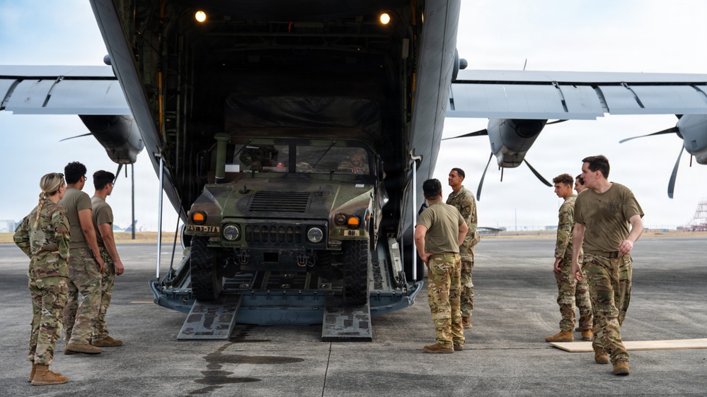 Balikatan 2026: 317th AW, 25th ID load Humvee, howitzer onto C-130J