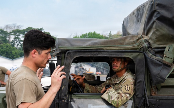 Balikatan 2026: 317th AW, 25th ID load Humvee, howitzer onto C-130J