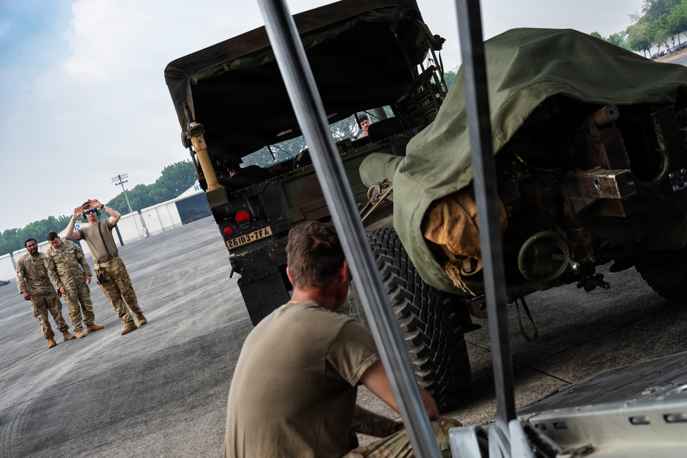 Balikatan 2026: 317th AW, 25th ID load Humvee, howitzer onto C-130J