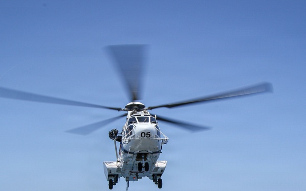Frank E. Petersen Jr. Conducts Vertical Replenishment-at-Sea with Wally Schirra