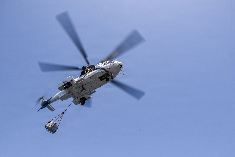 Frank E. Petersen Jr. Conducts Vertical Replenishment-at-Sea with Wally Schirra