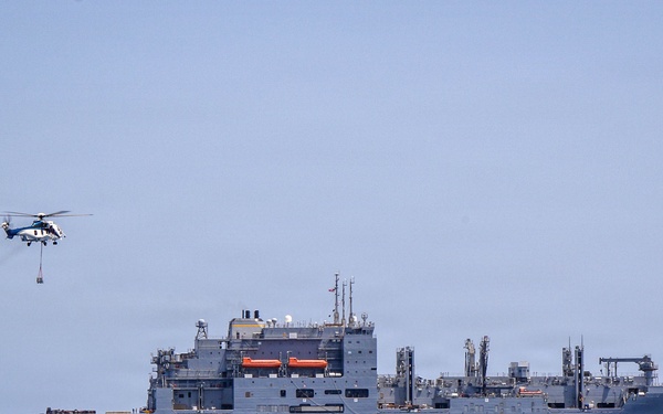 Frank E. Petersen Jr. Conducts Vertical Replenishment-at-Sea with Wally Schirra