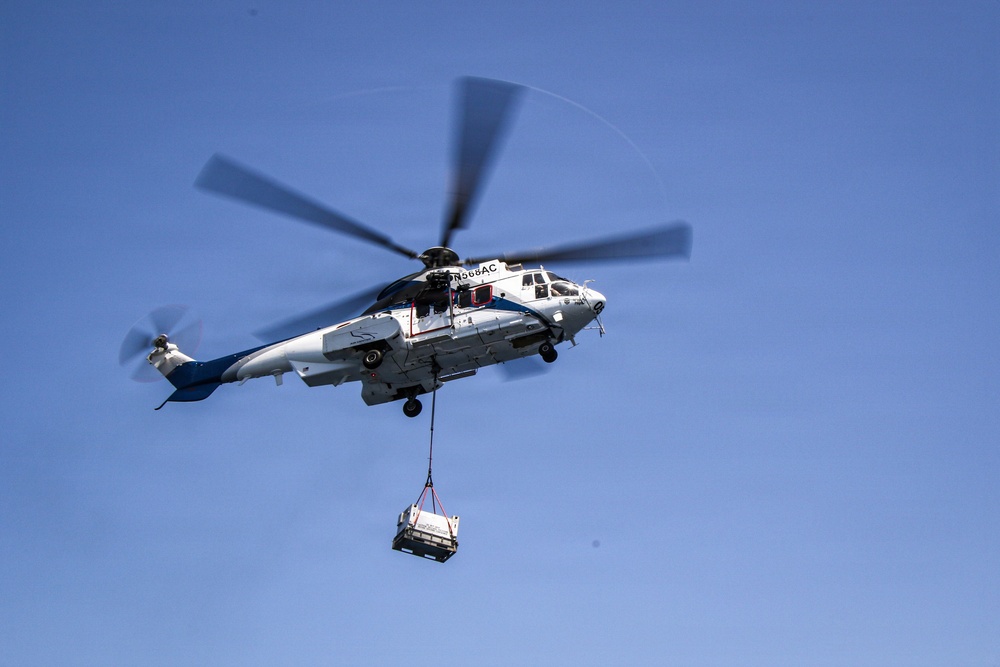 Frank E. Petersen Jr. Conducts Vertical Replenishment-at-Sea with Wally Schirra