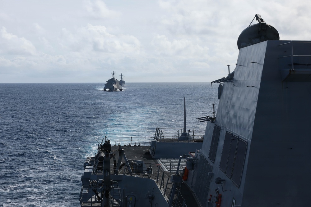 USS Carl M. Levin sails in formation with USS Charleston and USS Decatur