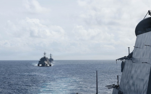 USS Carl M. Levin sails in formation with USS Charleston and USS Decatur