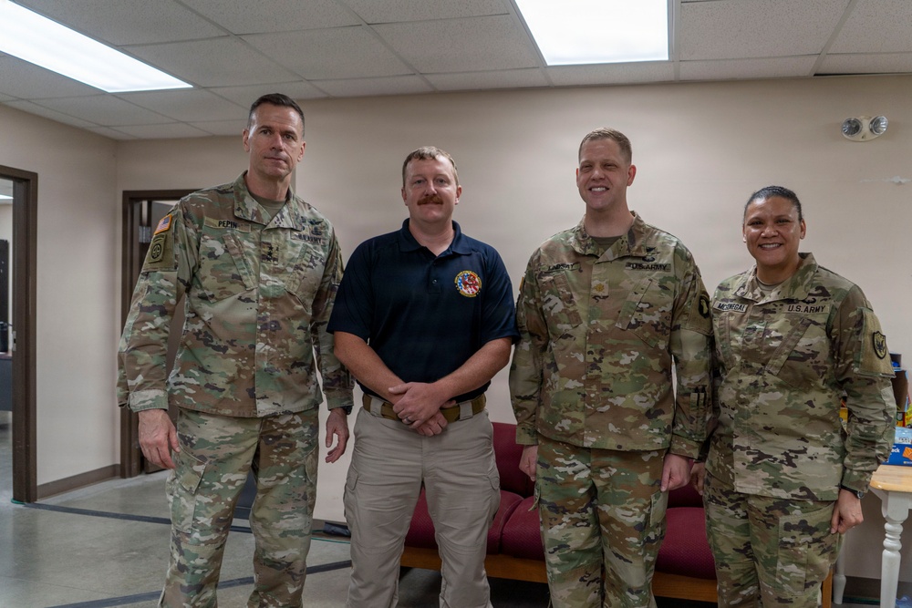 General Pepin Presents Coins to JTF-CS