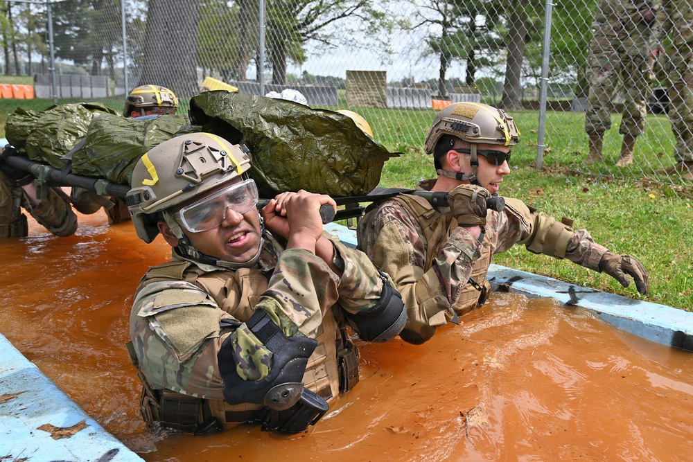 Overcoming Obstacles: CLS Students Carry Litter Through Water