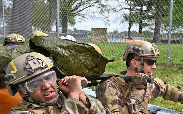 Overcoming Obstacles: CLS Students Carry Litter Through Water