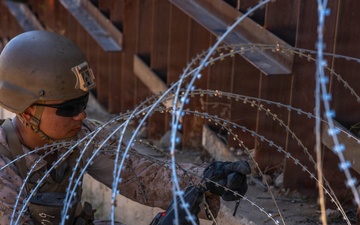 U.S. Marines with JTF-SB repair breach sites along southern barrier