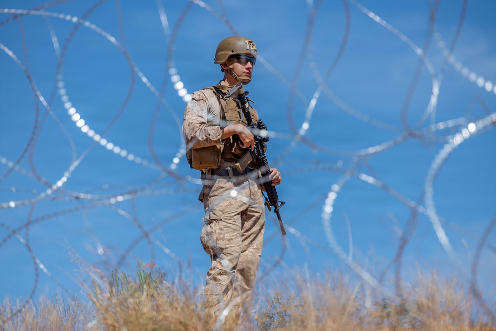U.S. Marines with JTF-SB repair breach sites along southern barrier