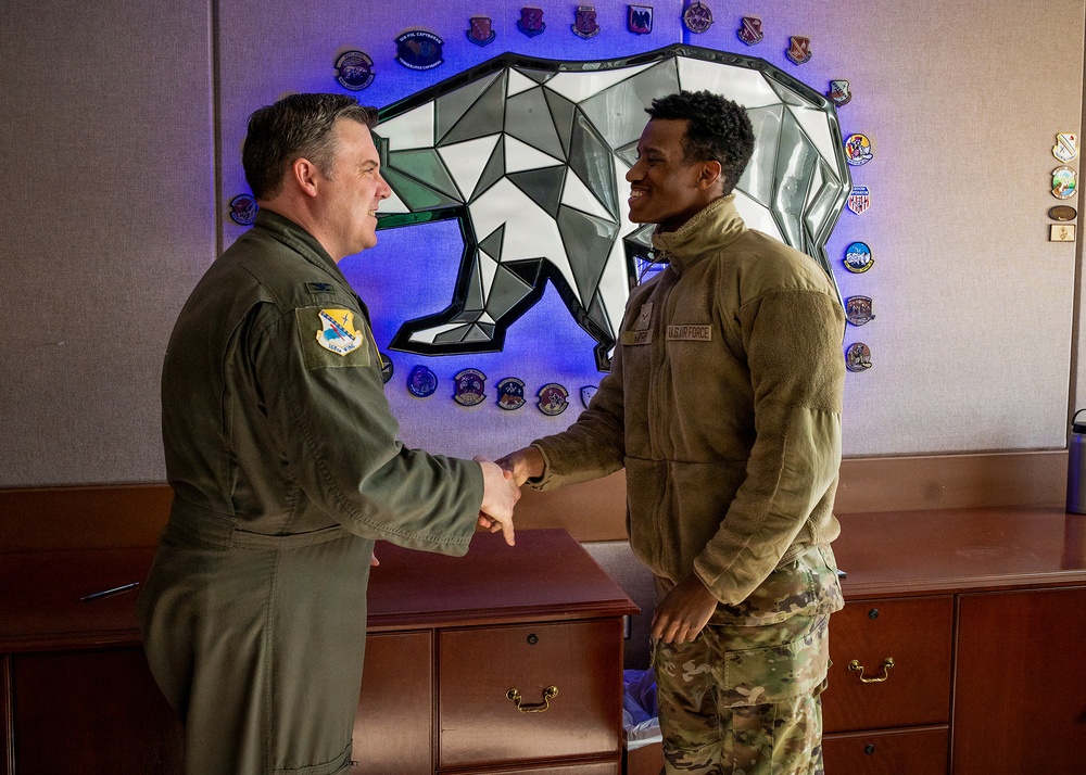168th Wing Commander presents his Commander Coin to 354th Medical Group Airmen