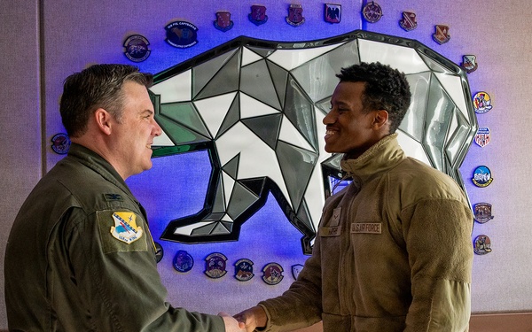 168th Wing Commander presents his Commander Coin to 354th Medical Group Airmen
