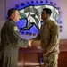 168th Wing Commander presents his Commander Coin to 354th Medical Group Airmen