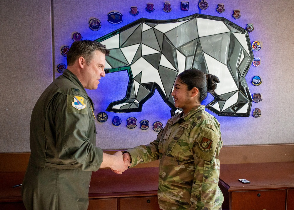 168th Wing Commander presents his Commander Coin to 354th Medical Group Airmen