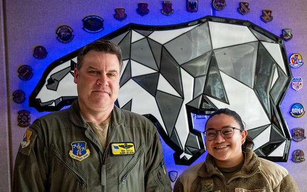 168th Wing Commander presents his Commander Coin to 354th Medical Group Airmen