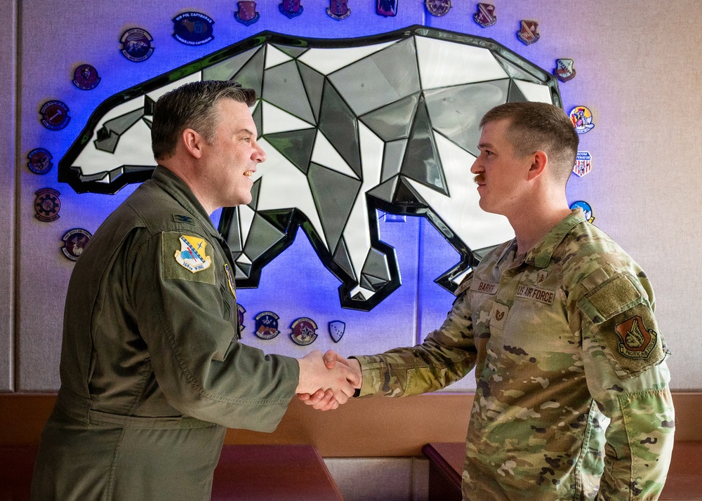 168th Wing Commander presents his Commander Coin to 354th Medical Group Airmen