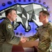 168th Wing Commander presents his Commander Coin to 354th Medical Group Airmen