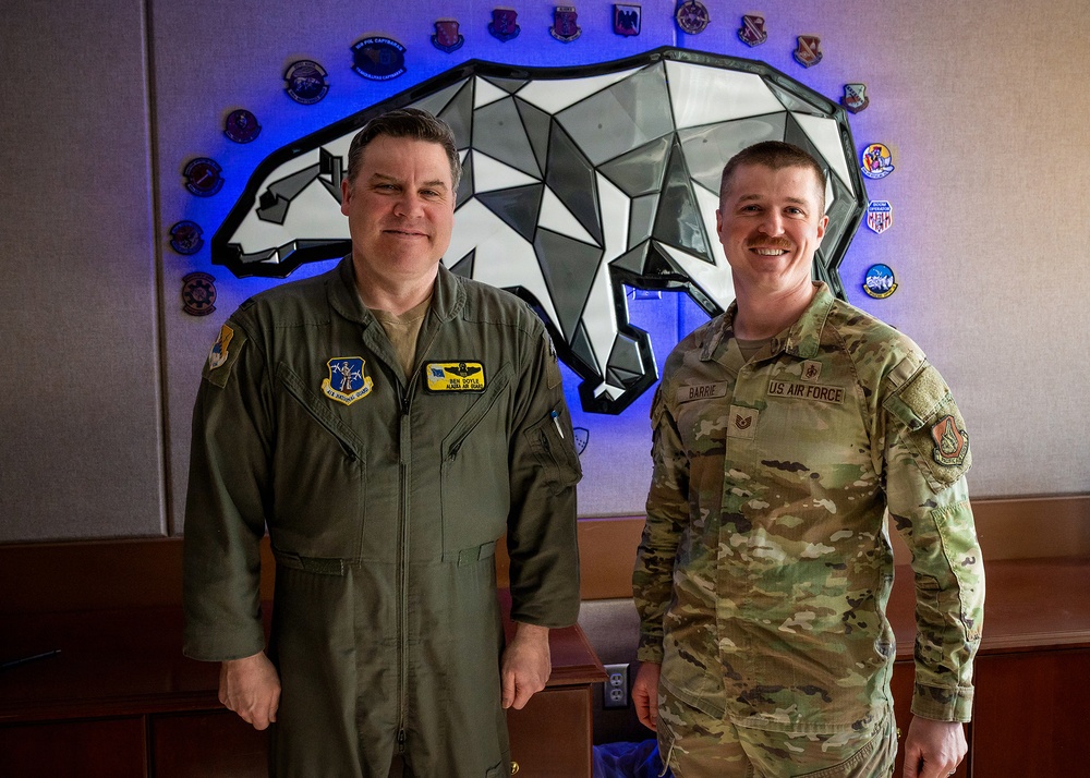 168th Wing Commander presents his Commander Coin to 354th Medical Group Airmen