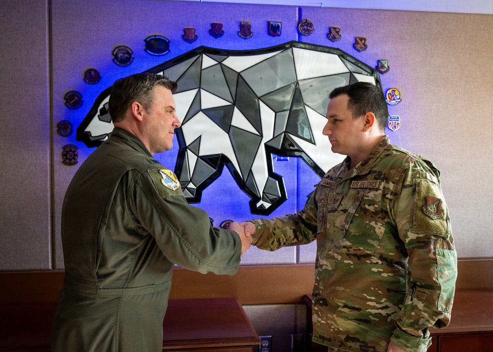 168th Wing Commander presents his Commander Coin to 354th Medical Group Airmen