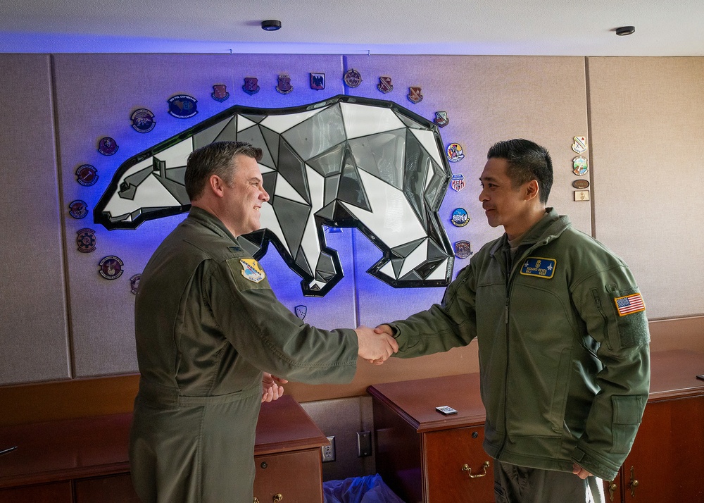 168th Wing Commander presents his Commander Coin to 354th Medical Group Airmen