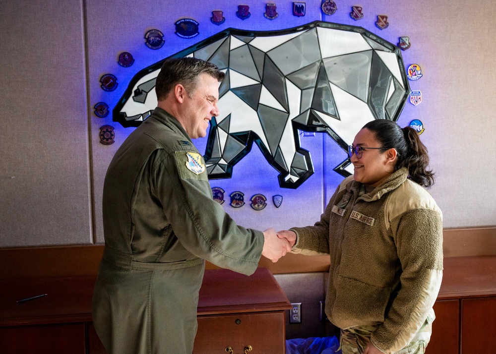 168th Wing Commander presents his Commander Coin to 354th Medical Group Airmen