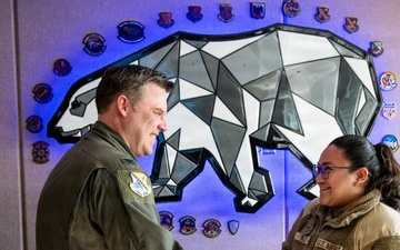 168th Wing Commander presents his Commander Coin to 354th Medical Group Airmen