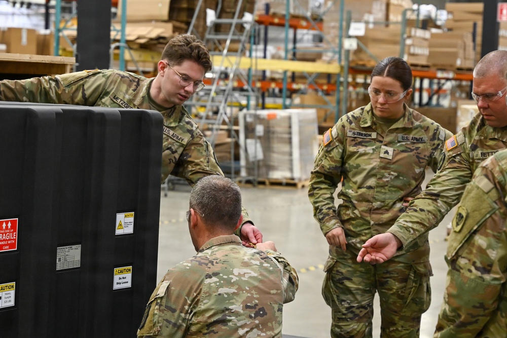 U.S. Army Tank-automotive and Armaments Command and Capability Program Executive for Combat Logistics team members field Refrigeration Tool Kits to members of Wisconsin Army National Guard