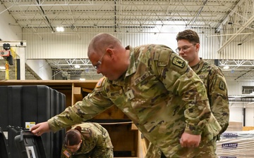 U.S. Army Tank-automotive and Armaments Command and Capability Program Executive for Combat Logistics team members field Refrigeration Tool Kits to members of Wisconsin Army National Guard