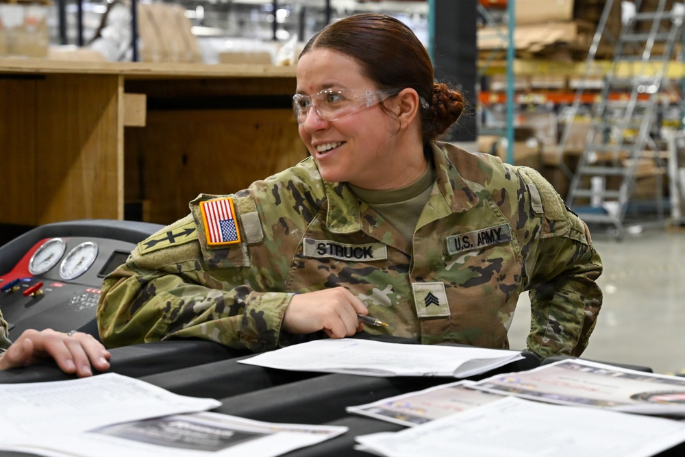 U.S. Army Tank-automotive and Armaments Command and Capability Program Executive for Combat Logistics team members field Refrigeration Tool Kits to members of Wisconsin Army National Guard