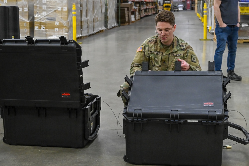 U.S. Army Tank-automotive and Armaments Command and Capability Program Executive for Combat Logistics team members field Refrigeration Tool Kits to members of Wisconsin Army National Guard