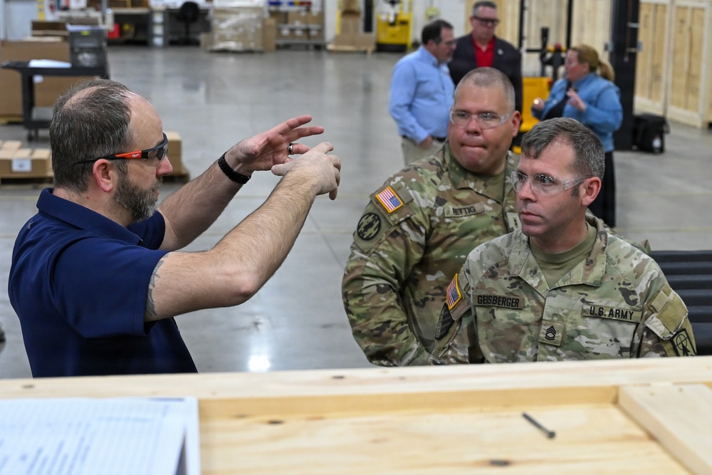 U.S. Army Tank-automotive and Armaments Command and Capability Program Executive for Combat Logistics team members field Refrigeration Tool Kits to members of Wisconsin Army National Guard