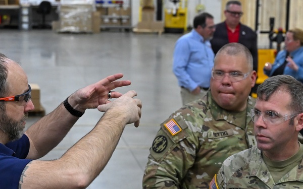 U.S. Army Tank-automotive and Armaments Command and Capability Program Executive for Combat Logistics team members field Refrigeration Tool Kits to members of Wisconsin Army National Guard