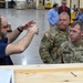 U.S. Army Tank-automotive and Armaments Command and Capability Program Executive for Combat Logistics team members field Refrigeration Tool Kits to members of Wisconsin Army National Guard