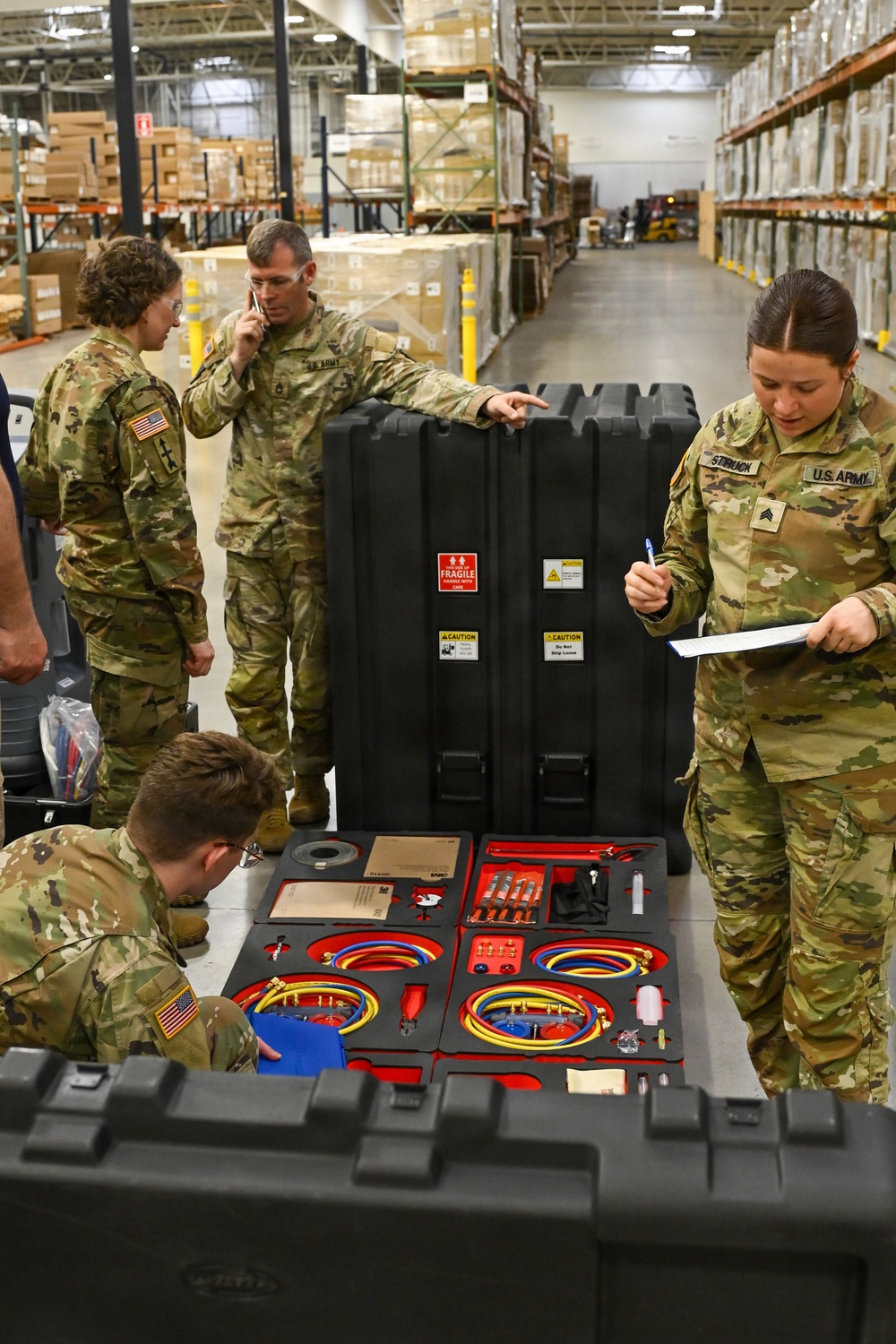 U.S. Army Tank-automotive and Armaments Command and Capability Program Executive for Combat Logistics team members field Refrigeration Tool Kits to members of Wisconsin Army National Guard