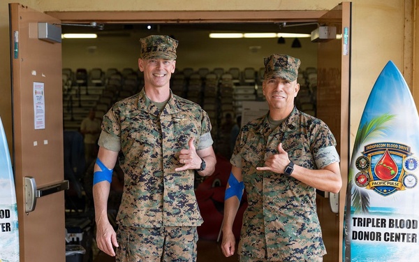 Col. Jeremy Beaven and Sgt. Maj. Adan Moreno donate to save lives