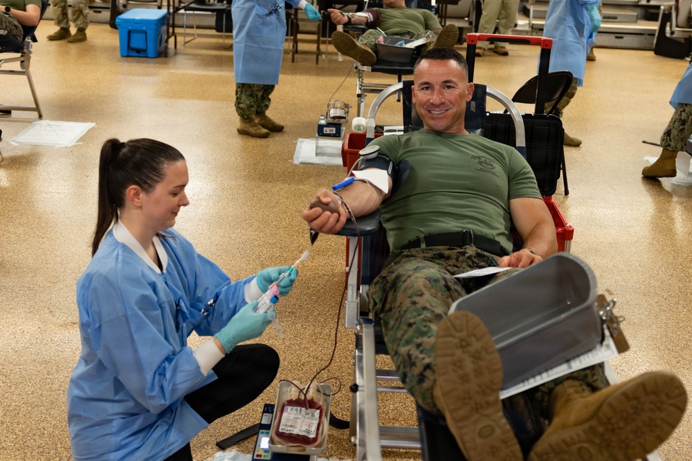 Lt. Col. Andrew Koch donates blood to save lives